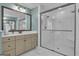 Bright bathroom with a marble tile floor, beige cabinets, and a glass-enclosed shower at 196 Old Highway 92, Fayetteville, GA 30215