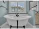 Elegant bathroom with a soaking tub and plantation shutters at 196 Old Highway 92, Fayetteville, GA 30215