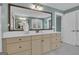 Bathroom features a large vanity with a white countertop, modern fixtures, and a large mirror at 196 Old Highway 92, Fayetteville, GA 30215