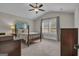 Bedroom with neutral carpeting, a four-poster bed, and a window that provides natural light at 196 Old Highway 92, Fayetteville, GA 30215