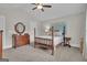 Bedroom features neutral colors, wood furniture, carpeting, and a ceiling fan at 196 Old Highway 92, Fayetteville, GA 30215