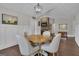 Open dining area with hardwood floors, a light fixture, and wainscoting at 196 Old Highway 92, Fayetteville, GA 30215