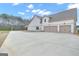 Long driveway and two-car garage offer ample parking space, adding convenience and functionality to the property at 196 Old Highway 92, Fayetteville, GA 30215