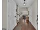 Warm and inviting entryway with hardwood floors, a stylish pendant light, and a view into the spacious living area at 196 Old Highway 92, Fayetteville, GA 30215