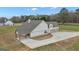Rear exterior of home with two-car garage, covered patio and outdoor seating at 196 Old Highway 92, Fayetteville, GA 30215