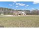 Charming home featuring stone accents, a covered porch, and spacious yard at 196 Old Highway 92, Fayetteville, GA 30215
