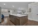 Open kitchen with an island, stainless appliances, and hardwood floors at 196 Old Highway 92, Fayetteville, GA 30215