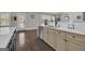 Open kitchen featuring stainless appliances, stone countertops, and hardwood floors at 196 Old Highway 92, Fayetteville, GA 30215