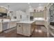 Spacious kitchen with large island, white countertops, stainless appliances, and natural wood floors at 196 Old Highway 92, Fayetteville, GA 30215