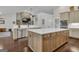 Kitchen features a large island, stainless steel appliances, and natural wood floors at 196 Old Highway 92, Fayetteville, GA 30215