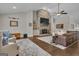 Spacious living room features a stone fireplace, ceiling fan, and plush seating area at 196 Old Highway 92, Fayetteville, GA 30215