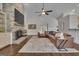 Cozy living room featuring a stone fireplace, comfortable seating, and open layout design at 196 Old Highway 92, Fayetteville, GA 30215