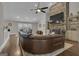 Open living room featuring a stone fireplace, large sectional couch, and hardwood floors throughout at 196 Old Highway 92, Fayetteville, GA 30215