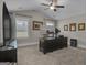 Bright office area with a large desk, a ceiling fan, and multiple windows providing natural light at 196 Old Highway 92, Fayetteville, GA 30215