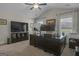 Home office with a dark wood desk, dual monitors, natural light, and neutral carpeting at 196 Old Highway 92, Fayetteville, GA 30215