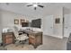 Home office with a ceiling fan, carpeting, and a dark wood L-shaped desk at 196 Old Highway 92, Fayetteville, GA 30215