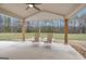 Comfortable covered patio with ample seating and a ceiling fan, ideal for enjoying the outdoors in any weather at 196 Old Highway 92, Fayetteville, GA 30215