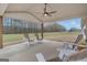 Inviting covered patio features wooden support beams, ceiling fan, and plenty of space for relaxing and entertaining at 196 Old Highway 92, Fayetteville, GA 30215