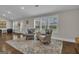 Elegant sitting area with armchairs, patterned rug, and bright natural light from windows at 196 Old Highway 92, Fayetteville, GA 30215