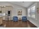 Bright sitting area with blue chairs, adjacent to kitchen with stainless steel refrigerator at 196 Old Highway 92, Fayetteville, GA 30215