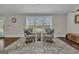 Well-lit sitting area with comfortable armchairs, decorative rug, and a view to the outdoors at 196 Old Highway 92, Fayetteville, GA 30215