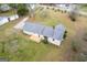 Aerial shot showcasing the home, expansive yard, new deck, and surrounding greenery at 1312 Milstead Ne Ave, Conyers, GA 30012