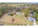 Expansive aerial view of 1312 Milstead Ave with a well-maintained lawn and mature trees at 1312 Milstead Ne Ave, Conyers, GA 30012