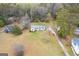 An aerial view of a cozy home with a spacious yard with mature trees at 1312 Milstead Ne Ave, Conyers, GA 30012