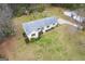 An aerial view of the home showcasing the roof, landscaping and curb appeal at 1312 Milstead Ne Ave, Conyers, GA 30012