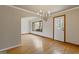 Well-lit dining area with hardwood floors offers an elegant space for entertaining at 1312 Milstead Ne Ave, Conyers, GA 30012