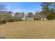 Spacious front yard showcasing the home's exterior and landscaping at 1312 Milstead Ne Ave, Conyers, GA 30012