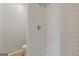 This shower has decorative white tile at 1312 Milstead Ne Ave, Conyers, GA 30012