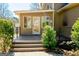 Inviting back porch with deck, steps to the yard, and view of the backyard at 260 Brookwood Ln, Fayetteville, GA 30215