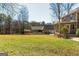 Large backyard with mature trees, sprawling lawn, and fence at 260 Brookwood Ln, Fayetteville, GA 30215