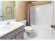 Clean bathroom featuring a tub with shower, commode, and a vanity with a white countertop at 260 Brookwood Ln, Fayetteville, GA 30215