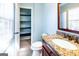 Bathroom featuring a granite countertop vanity, tiled floors, and natural light at 260 Brookwood Ln, Fayetteville, GA 30215