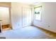 Cozy bedroom with neutral walls, plush carpeting, and a bright window at 260 Brookwood Ln, Fayetteville, GA 30215