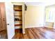 Bedroom featuring hardwood floors, storage closet, and natural light from the window at 260 Brookwood Ln, Fayetteville, GA 30215