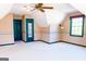 Spacious bedroom with neutral walls, carpet, and natural light from the window at 260 Brookwood Ln, Fayetteville, GA 30215