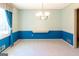 Bright dining room featuring blue wainscoting, a chandelier, and natural light at 260 Brookwood Ln, Fayetteville, GA 30215