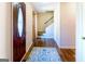 Inviting foyer features hardwood floors, a patterned rug, and a staircase at 260 Brookwood Ln, Fayetteville, GA 30215