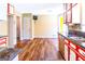 Spacious kitchen with wood floors, granite counters, and bright cabinetry at 260 Brookwood Ln, Fayetteville, GA 30215