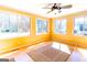 Bright sunroom with hardwood floors, large windows, and a ceiling fan at 260 Brookwood Ln, Fayetteville, GA 30215
