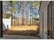 Backyard featuring large trees and back door to home at 3911 Waldrop Ln, Decatur, GA 30034