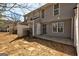 View of the backyard featuring the home's gray siding, patio and fenced yard at 3911 Waldrop Ln, Decatur, GA 30034