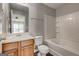 Bathroom featuring vanity, toilet, and bathtub with tiled surround at 3911 Waldrop Ln, Decatur, GA 30034