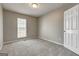 Cozy bedroom featuring neutral carpet and bright natural light at 3911 Waldrop Ln, Decatur, GA 30034