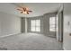 Spacious bedroom with neutral paint, plush carpet, and abundant natural light at 3911 Waldrop Ln, Decatur, GA 30034