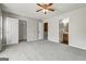 Well-lit bedroom featuring plush carpet and ensuite bathroom access at 3911 Waldrop Ln, Decatur, GA 30034