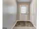 Bright hallway featuring luxury vinyl floors, leading to an exterior door at 3911 Waldrop Ln, Decatur, GA 30034